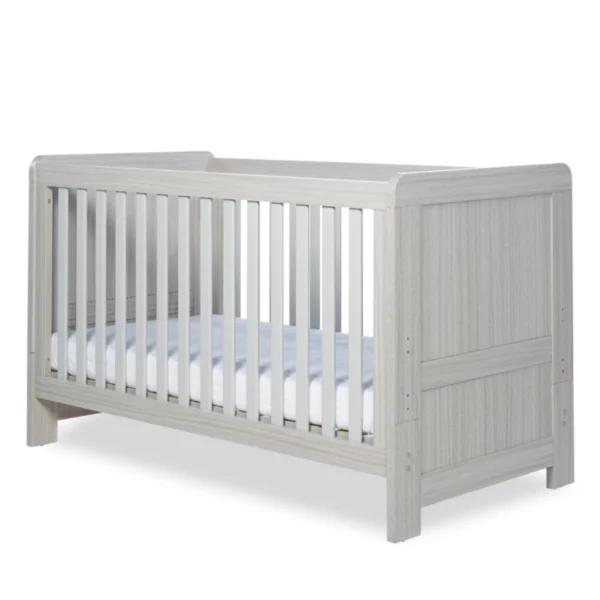 Light gray wooden baby cot bed with white slats and a mattress.