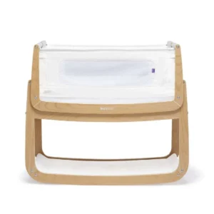 Wooden baby bassinet with white fabric lining and mesh side panel.